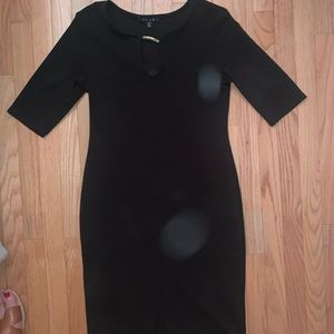 Black slim fitting dress with slit in front